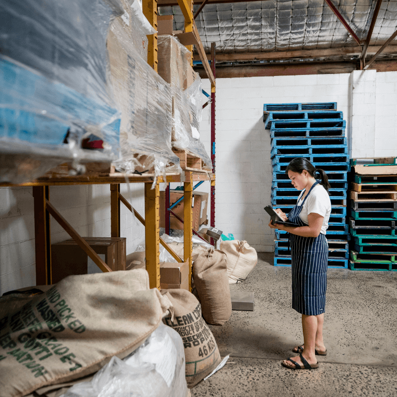 Young woman checking stock in a warehouse